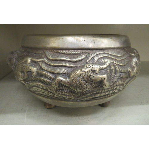 133 - A 19thC South East Asian Paktong censer of squat, bulbous form with opposing dragon handles, elevate... 