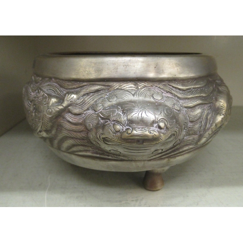 133 - A 19thC South East Asian Paktong censer of squat, bulbous form with opposing dragon handles, elevate... 
