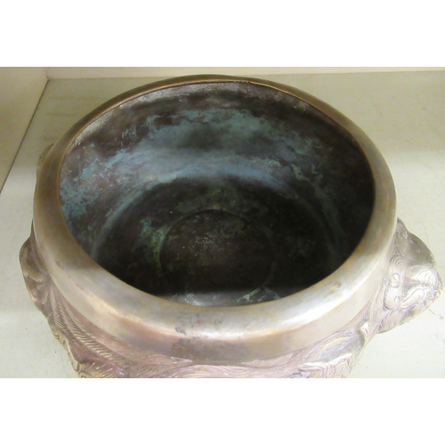 133 - A 19thC South East Asian Paktong censer of squat, bulbous form with opposing dragon handles, elevate... 