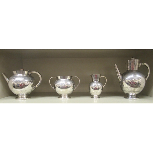 246 - A late Victorian Martin Hall & Co silver plated four piece tea set, in the manner of Christopher... 