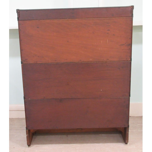 258 - An early 20thC oak, three section Globe Wernicke bookcase with rising glazed doors, on a plinth&nbsp... 