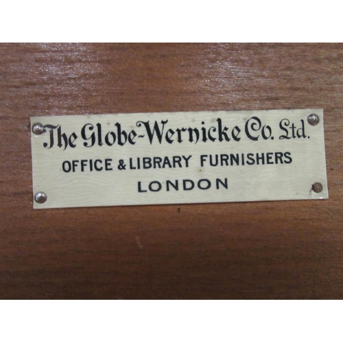 258 - An early 20thC oak, three section Globe Wernicke bookcase with rising glazed doors, on a plinth&nbsp... 