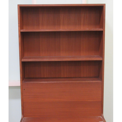 259 - A 1960s/70s teak living room unit with an arrangement of open shelves, doors and a fall flap, raised... 
