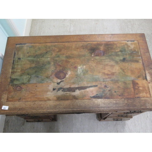 261 - An Edwardian oak twin pedestal desk with an arrangement of nine drawers, on a plinth&nbsp; 30