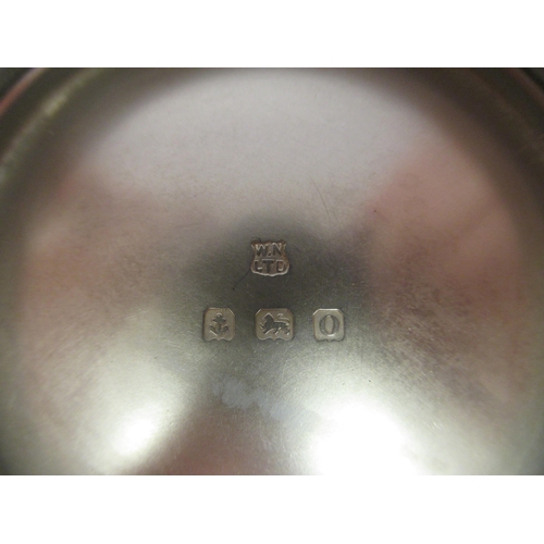 130 - A three piece silver tea set of cylindrical form with vertically line engraved ornament&nbsp; compri... 