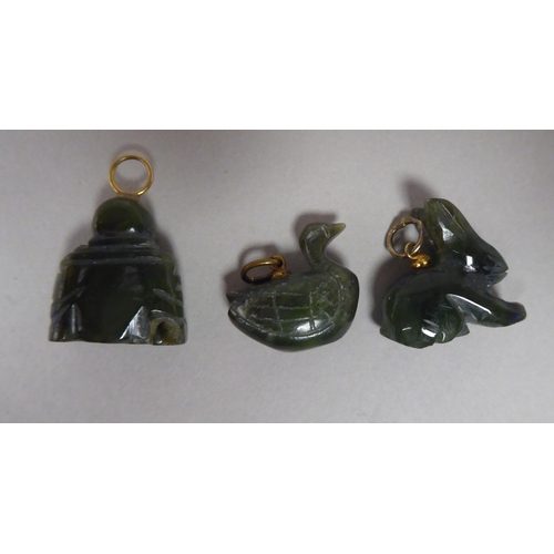 11 - Five jade coloured pendants