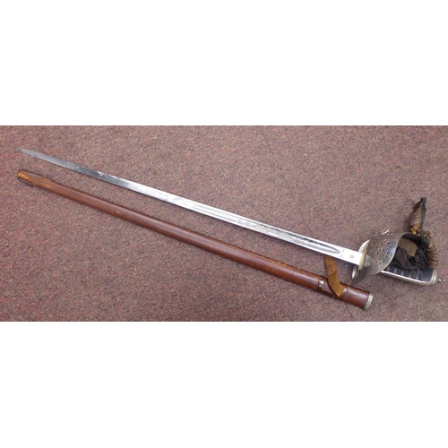 5 - A George VI military dress sword with a wire bound, shagreen handgrip, basket hilt and engraved blad... 