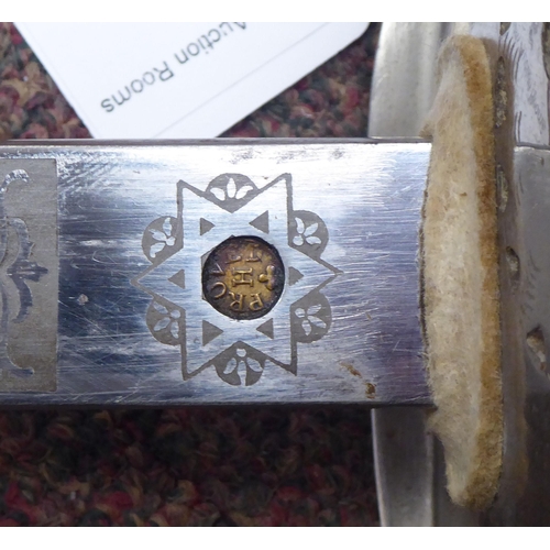 5 - A George VI military dress sword with a wire bound, shagreen handgrip, basket hilt and engraved blad... 