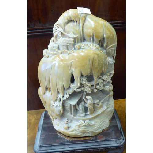 108 - Three Chinese carved soapstone sculptures: to include a mountain scene with figures  14