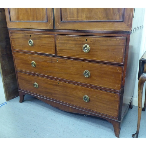 138 - A George III string inlaid mahogany linen press with a pair of doors, over two short/two long drawer... 