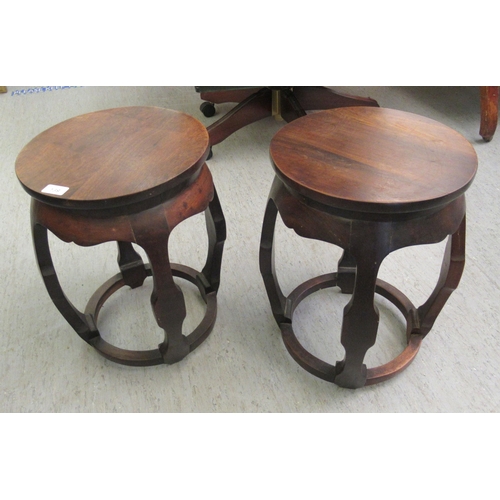 139 - Two 20thC Chinese barrel design fruitwood stools