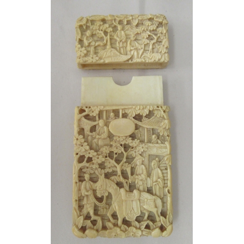 14 - A late 19thC Chinese ivory two part card case, densely carved with figures in landscapes  3.75