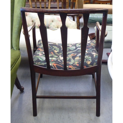 158 - A late 18thC Scottish mahogany framed Cockpen chair with open arms, the later patterned fabric uphol... 