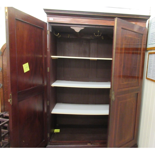 163 - An Edwardian string inlaid mahogany wardrobe with a pair of panelled doors, over a long base drawer,... 