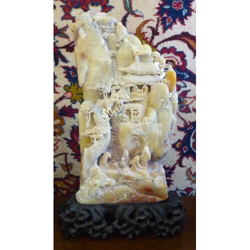 169 - Three Chinese carved soapstone sculptures: to include a mountainous landscapes with figures  7