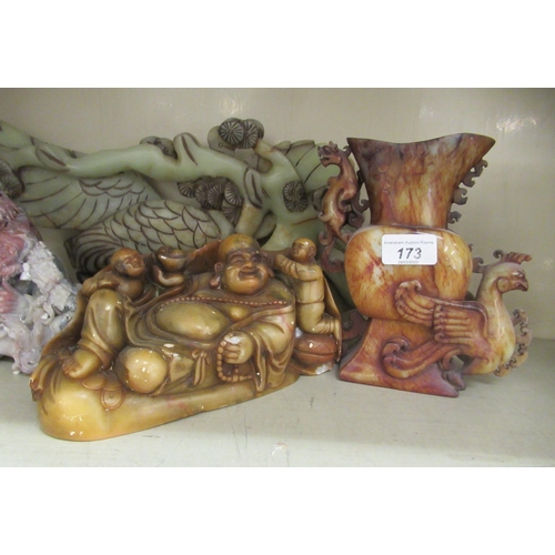 173 - Oriental collectables: to include a Chinese carved soapstone figural group  6.5