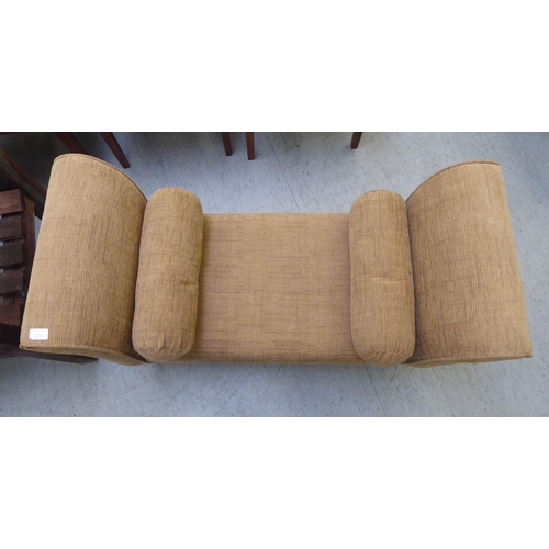 216 - A modern window seat, upholstered in mid brown fabric, raised on short cabriole legs 