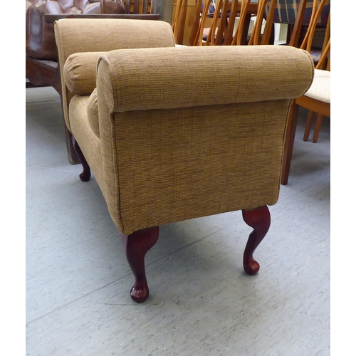 216 - A modern window seat, upholstered in mid brown fabric, raised on short cabriole legs 