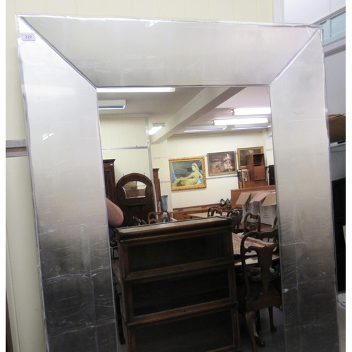 229 - A modern dressing mirror, set in a wide glazed and mitred silvered frame  79