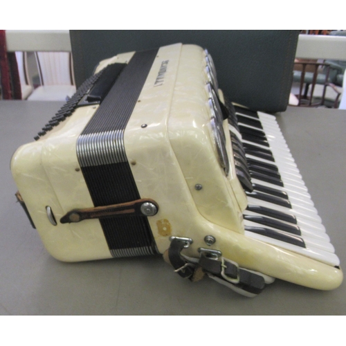 236 - A (probably 1970s) Scandalli piano accordion, in a marble effect case and outer hard case