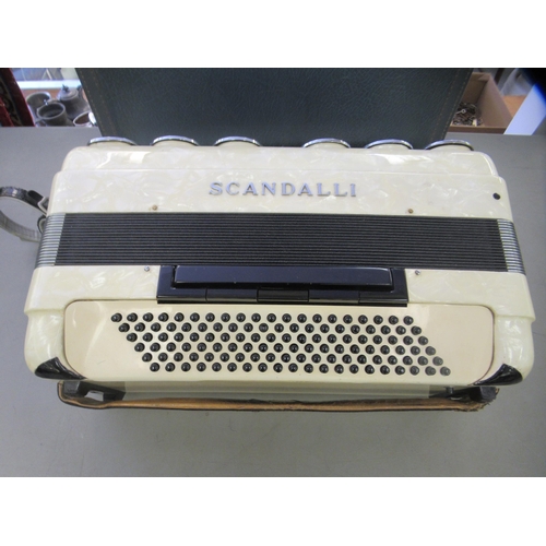 236 - A (probably 1970s) Scandalli piano accordion, in a marble effect case and outer hard case