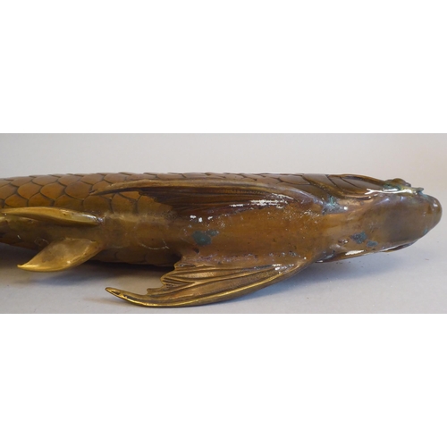 24 - A patinated bronze metal model, a carp  17.5