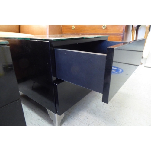 255 - A pair of modern textured black lacquered, two drawer side tables with mottled faux marble glazed to... 