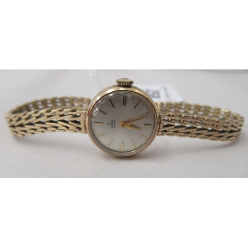 258 - A ladies Tudor 9ct gold bracelet wristwatch, faced by a baton dial  cased