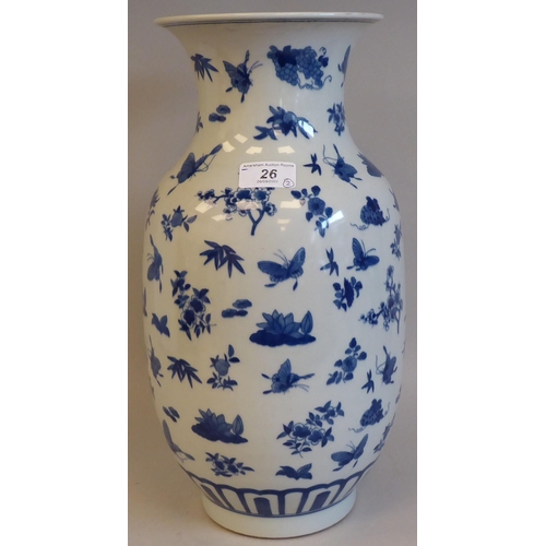 26 - Chinese ceramics: to include a 20thC  porcelain vase, decorated with butterflies  bears a six charac... 