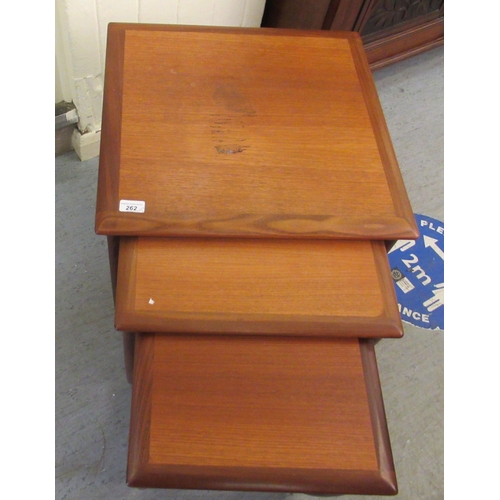 262 - A nesting set of three G-Plan teak occasional tables, raised on U-shaped supports  largest 22