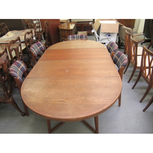 268 - A 1970s Danish teak dining table, raised on splayed supports  28