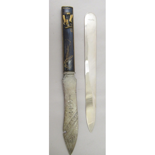 29 - Oriental collectables: to include a Japanese silver coloured metal letter opener, the handle decorat... 