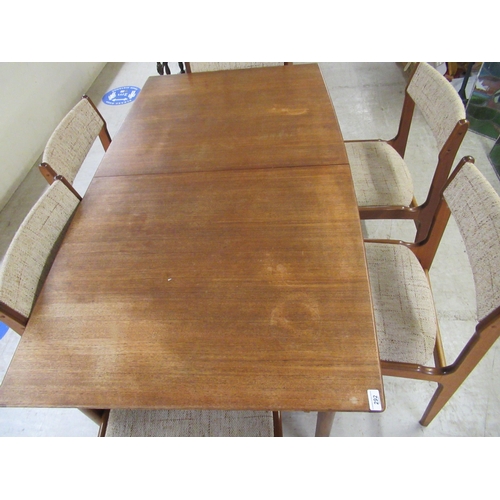 292 - A modern teak dining table, raised on tapered legs  29