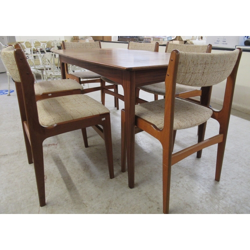 292 - A modern teak dining table, raised on tapered legs  29