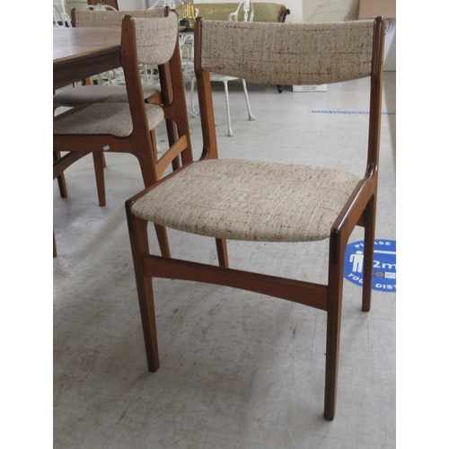 292 - A modern teak dining table, raised on tapered legs  29