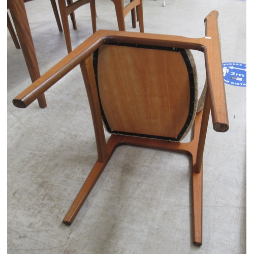 292 - A modern teak dining table, raised on tapered legs  29