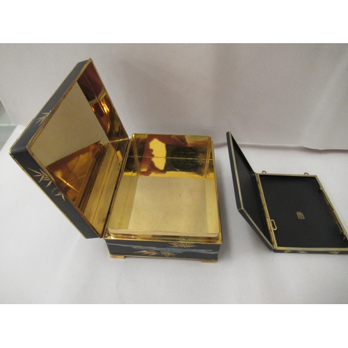 3 - 20thC gilt and black metal collectables: to include a cigarette box, decorated with flora  4