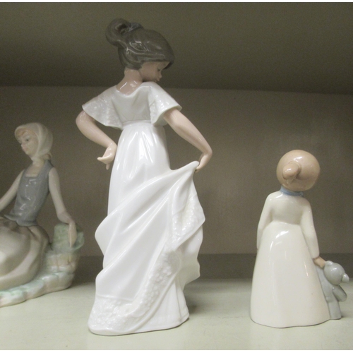 300 - Lladro, Nao and Valencia porcelain figures: to include mainly women in different poses  largest 9