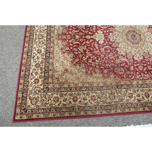 308 - A Tiara rug with floral motifs on a red ground  78