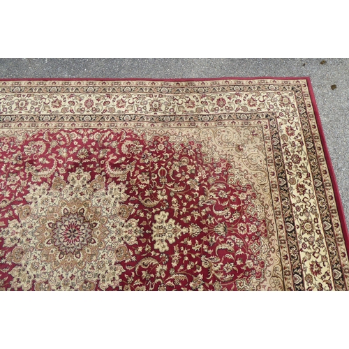 308 - A Tiara rug with floral motifs on a red ground  78