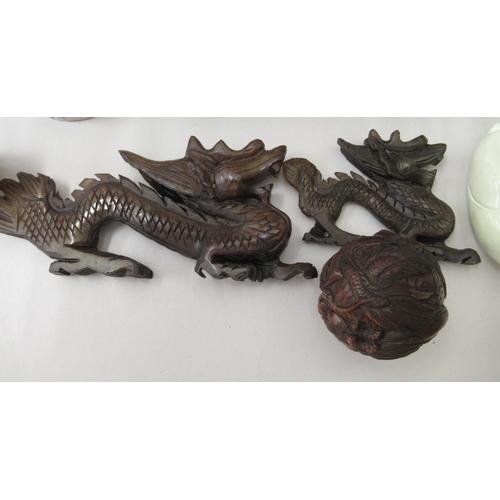 31 - Oriental collectables: to include a 20thC Japanese carved fruitwood netsuke, fashioned as a dragon