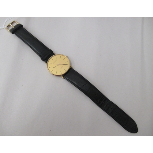 310 - A Mappin & Webb 9ct gold cased wristwatch, the quartz movement faced by a baton dial, on a black... 