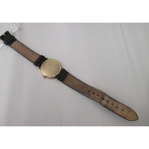 310 - A Mappin & Webb 9ct gold cased wristwatch, the quartz movement faced by a baton dial, on a black... 