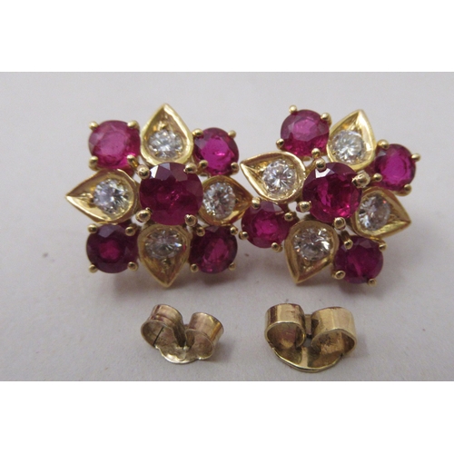 312 - A pair of 18ct gold claw set earrings, set with rubies and diamonds 