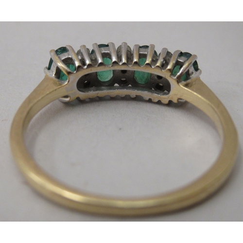 317 - An 18ct gold ring, set with emeralds and diamonds