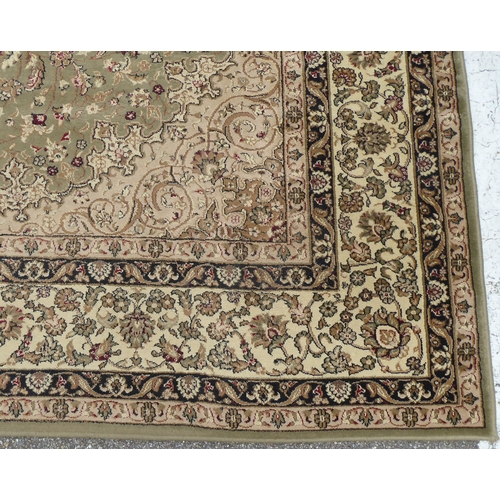 326 - A Tiara rug with floral motifs on a beige ground  78