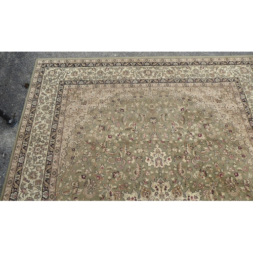 326 - A Tiara rug with floral motifs on a beige ground  78