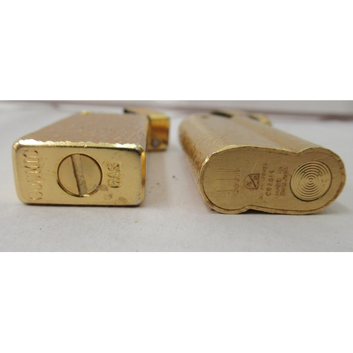 341 - A gold plated Dunhill lighter, model no.C62814; and another gold plated example