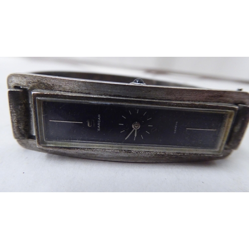 342 - A ladies silver Sarcar bracelet wristwatch, faced by a baton dial  stamped 0800; and an Orienta... 