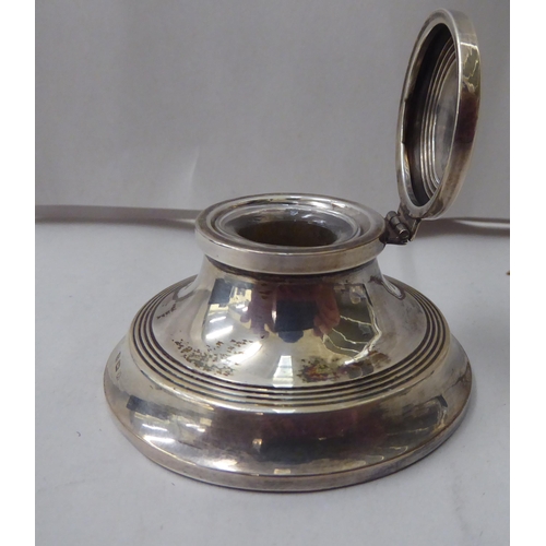 343 - A silver Capstan design inkwell  Birmingham 1925; and a Sterling silver cased pen  cased